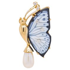 This exquisite pendant brooch is truly one of a kind. Crafted with meticulous attention to detail, it showcases a breathtaking combination of materials and artistry. The focal point of this piece is a hand-carved agate butterfly wing, delicately set in a stunning 18 Karat yellow gold frame. The agate wing, carefully selected for its natural beauty, has been skilfully dyed to create a striking contrast between black and white hues. The carving work has been masterfully executed on the white porti Butterfly Carving, Carved Agate, Jewelry Classic, Pendant Brooch, Gold Bodies, Butterfly Wing, Couture Jewelry, Matching Rings, Gold Hands