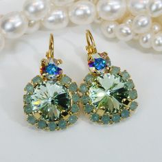 "Mint Drop Earrings Mint premium Crystal Gold Earrings Mint Ab Drop Earring Mint Wedding Mint Gold Set Pacific Opal Halo earring,Gold,GE102 A sparkly pair of Drop Earrings made with two genuine 7mm (29SS) and 10mm (48SS) premium high quality crystals. The large stone is Surrounded by small sparkling crystals. Total diameter of the large stone and strass 5/8\" (16mm) The length of stone area 3/4\" (19mm) Total Length of earring 1\" (25mm) Will add just the right hint of color. Ring: A sparkly com Wedding Mint, Unique Wedding Jewelry, Round Diamond Earrings, Mint Gold, Mint Wedding, Halo Earrings, Earring Gold, Etsy Wedding, Cz Jewelry