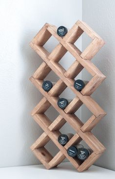 Build this easy DIY small bottle storage for kitchen or craft room. Use it spice storage or craft paint bottles. Sit it on the counter or hang it on the wall. Get the plans to build it today!