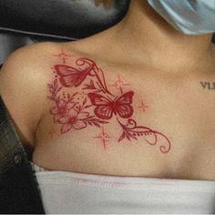 a woman with a butterfly tattoo on her chest