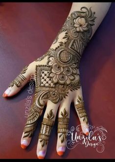 the hand is decorated with henna designs