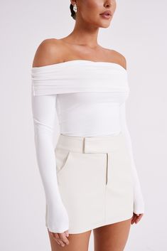 The cool shoulder. LUCINDA is a long-sleeved off-shoulder top with a ruched neckline and a slightly cropped torso. Cut from comfortable, preferred fibres, it has a semi-bodycon fit that hugs and flatters your curves. A modest piece with a modern design, this top is fresh and versatile. Fitted White Off-shoulder Top For Fall, Chic Long Sleeve Ruched Off-shoulder Top, Chic Ruched Off-shoulder Long Sleeve Top, White Stretch Long Sleeve Off-shoulder Top, White Stretch Off-shoulder Long Sleeve Top, White Fitted Off-shoulder Top, Fitted Long Sleeve Off-shoulder Top For Spring, Spring Off-shoulder Long Sleeve Top, Spring Long Sleeve Off-shoulder Top With Elastic Shoulders