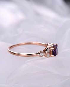 A 1 carat 6mm round Cut Natural Amethyst ring Accent stones: white CZ The stones of the ring can be replace with other different kinds of gemstone such as morganite, aquamarine, amethyst, citrine, white CZ, pink CZ,etc. If you want to customize your own personal ring, please feel free to contact with me. (925 sterling silver white/yellow/rose gold plated or solid 14k white/yellow/rose gold are available) 14 days money back guarantee. Amethyst Engagement Ring, Wedding Band Vintage, Amethyst Ring Engagement, Art Deco Wedding Band, Vintage Wedding Band, Deco Wedding, Local Jewelry, Beautiful Engagement Rings, Purple Band