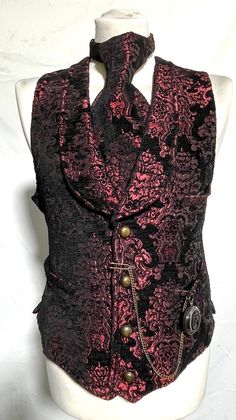 F5-4 # RVQ1001X  wine colour with black rich looking Tapestry Men's Classic English regency, wedding groom, steampunk waistcoat with 4 buttons and 3 functional pockets, 2 on waist and 1  breast pocket. Back of the waistcoat is corseted,back belt with eyelets lacing. it is fully lined.  please note chain & chain watch is not including in this sale.  thank you  Please refer to photos. Size Available To Fit chest  S to fit chest 38" M to fit chest 40" L to fit chest 42" XL to fit chest 46" XXL to f Steampunk Formal Sleeveless Vest, Formal Steampunk Sleeveless Vest, Formal Sleeveless Steampunk Vest, Elegant Fitted Red Vest, Steampunk Fitted Vest With Buttons, Elegant Black Vest For Costume Party, Elegant Fitted Vest For Costume, Elegant Fitted Vest For Costume Party, Black Elegant Vest For Costume