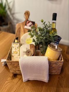 a wooden table topped with a basket filled with food