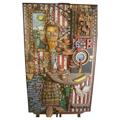 an art piece with many different items on it's sides, including scissors and other things