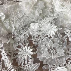 white lace with flowers and leaves on it