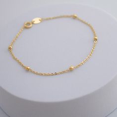 stay stylish every day with the dream a little dream bracelet. the delicate construction makes it the perfect everyday accessory for all your layered looks, or to be worn alone for a beautiful, classic look. pick up this essential piece to start creating beautiful layered looks. 18kt BR gold filled 7.5" long Everyday Gold Bracelet For Women, Delicate Gold Bracelet For Women, Real Gold Bracelet For Women, Dainty Yellow Gold Beaded Bracelets In 14k Gold Filled, Adjustable Minimalist 14k Gold Filled Charm Bracelet, Adjustable 14k Gold Filled Bracelets With Satellite Chain, Dainty Stackable Bracelets For Everyday, Classic Adjustable Bracelet With Delicate Chain, Dainty Everyday Stackable Bracelets