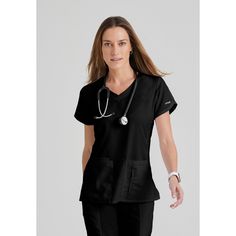 Your job is a workout, which is why we created this women's Grey's Anatomy™ by Barco scrub top. Soft, moisture-wicking fabric keeps you dry when the pressure's on. A design inspired by your favorite athletic gear includes a comfortable crossover V-neck and side slits for freedom of movement. A zip pocket keeps your phone tucked away. Female Features, Athletic Gear, Work Environment, Comfort Color, Grey's Anatomy, Scrub Tops, Work Attire, Greys Anatomy, Moisture Wicking Fabric