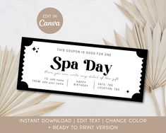 a spa day ticket sitting on top of a table next to palm leaves and flowers