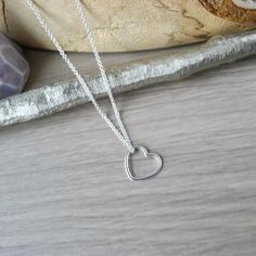 A little heart for a little love.An 11mm Sterling Silver Heart pendant hung on a Sterling Silver Chain Necklace.✭ CUSTOMIZE YOUR PIECE ✭► Choose your chain length 16in or 18in options for No Additional Charge! Don't see the length you need? Check out our Custom Length Upgrade: https://www.etsy.com/ca/listing/198366701/custom-chain-length-upgrade► Upgrade to a Thicker Chain here:https://www.etsy.com/ca/SilverMooseArts/listing/817185940/chain-upgrade-sterling-silver-chain► You can also personalize Heart Minimalist, Heart Simple, Custom Chain, Modern Heart, Sterling Silver Heart Pendant, Silver Heart Pendant, Sterling Silver Chain Necklace, Silver Chain Necklace, Necklace Sterling Silver