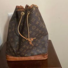 Vintage Louis Vuitton Bucket Bag Little Wet And Tear But So Much Life Left! Needs A Little Repair At Top Posted On The Pictures! Monogram Canvas Bucket Bag For Travel With Dust Bag, Travel Bucket Bag In Monogram Canvas With Dust Bag, Brown Monogram Canvas Bucket Bag, Louis Vuitton Bucket Bag, Louis Vuitton Brown, Large Shoulder Bags, Vintage Louis Vuitton, Louis Vuitton Bags, Louis Vuitton Bag