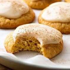 some cookies with icing and cinnamon on top