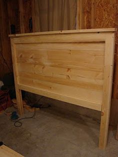 a bed frame made out of wood with no headboard or foot board on it