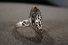 I am offering you this gorgeous vintage sterling silver (stamped) wedding band stacker design ring in a gorgeous fancy filigree scrolled design Very regal fancy raised relief presentation, in a fabulous victorian style, giving this such Allure and extra interest. This ring is currently a size 7, however it could be sized up or down very easily. It weighs app. 7 grams. It measures a bit under 1 inch. This ring came out of an estate in Maine. This unique vintage ring is a must have for the ring co Vintage Engraved Ring In Antique Silver For Wedding, Vintage Sterling Silver Filigree Ring With Intricate Design, Vintage Silver Filigree Ring, Ornate Silver Engraved Ring For Promise, Ornate Silver Engraved Promise Ring, Heirloom Silver Filigree Ring With Intricate Design, Ornate Sterling Silver Filigree Ring With Intricate Design, Ornate Filigree Ring Stamped 925 For Anniversary, Ornate Filigree Ring For Anniversary, Stamped 925