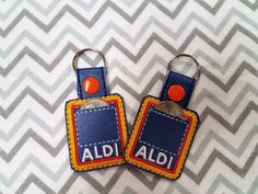 two luggage tags with the word aid on them