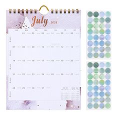 a calendar and stickers with the word july on it