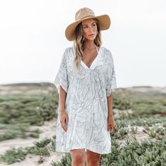 Introducing the Plunging-V Palm Midi Cover-Up! The plunging-V neckline with frayed trim and minimalist-inspired palm pattern brings a touch of tropical elegance to this stylish cover-up. Whether lounging by the pool or strolling along the shore, this midi cover-up is your go-to for a chic layer that transitions from sunny days to breezy evenings. Product code: CAA07B4A017AC Tropical V-neck Beach Dress For Day Out, V-neck Tropical Print Beach Dress For Vacation, Tropical V-neck Beach Dress For Spring, Tropical V-neck Beach Dress For Summer, Summer V-neck Cover-up With Tropical Print, White V-neck Beach Dress, Summer V-neck Beach Dress With Tropical Print, Summer Beach Dress With Tropical Print And V-neck, White Tropical Beach Dress For Spring