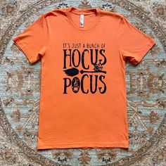 In New Condition And Absolutely No Flaws. Size Small And 100% Cotton. Top Is About 27.5" Long From Top Of Shoulder To Hem. Pit To Pit Measurement Is 17". Sleeve Opening Is 6.5" Wide. Perfect For Any Halloween Or Hocus Pocus Lover. Hocus Pocus Shirts, Hocus Pocus Shirt, Disney Tops, Hocus Pocus, Cotton Top, Bright Orange, Orange Black, Orange Color, Graphic T Shirt