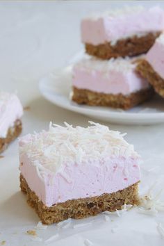 several pieces of cake sitting on top of a white plate next to another piece of cake