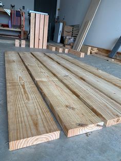 several pieces of wood sitting on the floor in a room that is being worked on