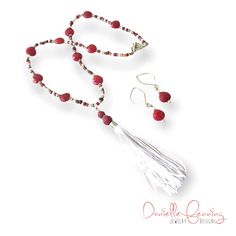 This handmade necklace and earrings set is made from a handmade white tassel with red dyed wood beads; semiprecious red jade faceted teardrops; glass seeds beads in brown, burgundy red, and white; and silver-tone components. Multi Coloured Necklaces, Red Jade, White Tassel, Necklace And Earrings Set, Colourful Necklace, Necklace And Earrings, Handmade Necklace, Burgundy Red, Earrings Set