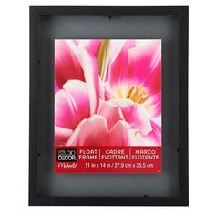 a black frame with pink flowers in it