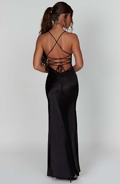 If you are looking for a super soft, romantic silhouette that skims over the body and enhances your figure, meet the Isobel maxi. Made from our silky soft satin with a bias cut, Isobel features a plunge neck, super low back with tie straps and a thigh high split.



Colour: Black. 

Non stretch bias cut satin.

Thigh high split.

Plunge v-neck.

Hugs the figure.

Super low back with tie straps.

Maxi length.

Model is a size XS and is wearing an XS.

 Size: XS, S, M, L, XL, XXL Babyboo Fashion, Homecoming Dresses Corset, Midi Dress Wedding Guest, Maxi Dress Sale, Sparkle Dress, Dress Inspo, Dresses By Length, Formal Dresses Prom, Flowy Dress