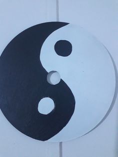 a black and white yin - yang symbol on a wall