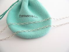 Overview:Offered for sale is a gorgeous Tiffany & Co. Large Silver & 18K Gold Round Locks necklace. The necklace is a wonderful piece that is simple, elegant, and classic all rolled into one. It works perfectly with pretty much any attire your put on, AND adds a nice feminine touch to it. Hanging from its gorgeous Tiffany sterling silver Oval Link chain is a very pretty Large Sterling Silver & 18K Gold Round Locks charm. It is a wonderful necklace that fits a lifestyle on the go -- t Elegant Oval Sterling Silver Chain Necklace, Elegant Oval Chain Necklace For Gifts, Elegant Oval Chain Necklace For Formal Occasions, Classic Oval Pendant Chain Necklace For Formal Occasions, Elegant Oval Chain Necklace For Anniversary, Elegant Sterling Silver Hallmarked Chain Necklace, Formal Oval Cable Chain Necklace, Elegant Oval Link Chain Necklace For Anniversary, Elegant Oval Chain Necklace With Delicate Chain