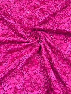 the pink fabric is very shiny and has many small dots on it's surface