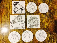 four stickers with pictures of children in bathtub on top of a marble counter