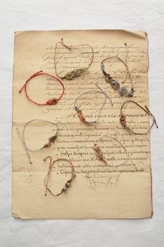 an old piece of paper with various bracelets on it