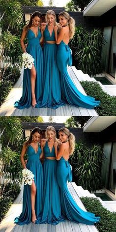 three women in blue dresses posing for the camera