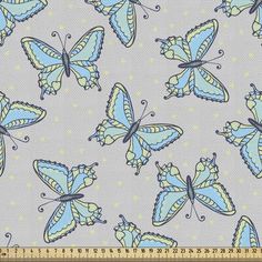 blue and yellow butterflies on grey fabric