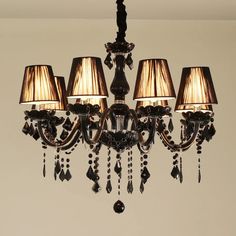 a chandelier with five lamps hanging from it