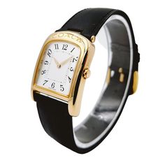 Ladies Coach 26mm Gold Plated Watch with Genuine Black Leather Band and White Dial. NEW / Unworn SN# 500**** Brand: Coach. Model: W501. Case Back: Solid. Metal: Gold Plated. Bezel: Gold Plated. Gender: Women's. Dial Color: White. Case Dimensions: 19mm. Condition: Excellent Condition. Bracelet / Strap: Black Leather. Movement: Quartz (Movement). Bracelet Size: Measures 7.50" (inches). Box / Paper: Includes Original Coach Box. Warranty: One (1) Year Limited Service Warranty. Classic Leather Strap Watch For Office, Classic Watch Accessories With Leather Strap For Work, Classic Leather Watch Accessories For Office, Classic Adjustable Watches With Polished Finish, Classic Evening Watch With Bracelet Strap, Classic Leather Watch Accessories For Work, Classic Gold Coach Watch, Luxury Gold Coach Watch Accessories, Classic Watch Bands With Polished Finish