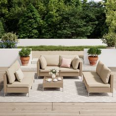 an outdoor patio with furniture and potted plants