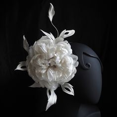 Dare to stand out and attract admiring glances and compliments? Then this oversized silk peony headpiece is exactly what you require. Created using a variety of delicate silk fabrics it perfectly completes your wedding outfit. The hand crafted peony is set amongst stylised foliage in the light silver colour. Made using cherry picked fabrics with different textures, the oversized silk peony floral headpiece is perfect for Spring / Summer weddings, garden parties or a day at the races. The leaves Silk Peonies, Flower Corsage, Wedding Fascinators, Floral Headpiece, Fabric Ribbon, Flower Headband, Silver Flowers, Bridal Headpieces, Wedding Hair Accessories