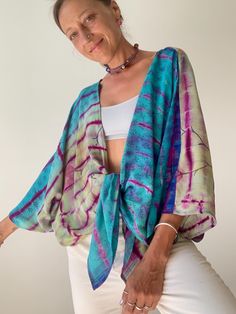 Beautiful silk over top witch wrap tie front Made in light sheer crepe silk, oversize loose and comfy over top  Perfect blouse for daily wear and vacation  MEAESURE Free size  MATERIAL * tie dye crepe silk  Thank you for looking Summer Beach Cover-up Flowy Blouse, Multicolor Flowy Wrap Cover-up, Summer Long Sleeve Tie Dye Blouse, Summer Tie-dye Long Sleeve Blouse, Long Sleeve Tie Dye Blouse For Summer, Summer Tie Dye Long Sleeve Blouse, Long Sleeve Tie-dye Blouse For Summer, Blue Summer Blouse With Tie Sleeves, Summer Tops With Relaxed Fit And Kimono Sleeves