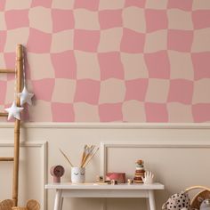 a pink and white checkered wall in a child's room