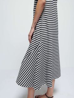 It's your essential t-shirt dress, now with subtle seamed pleats on the front for an effortlessly feminine silhouette. Perfect for moving from off-duty to on-duty with nothing more than a chic belt around the waist. (This one comes in City Stripe.) | Eileen Dress in City Stripe | Ethical Essentials Casual Dress With Relaxed Skirt For Daywear, Casual Midi Dress With Relaxed Skirt, Effortless Summer Dresses For Everyday, Chic Belt, Striped T Shirt Dress, Stripe T Shirt, Feminine Silhouette, Nothing More, Off Duty