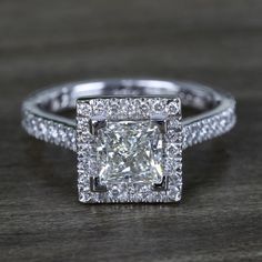 a cushion cut diamond surrounded by pave set diamonds