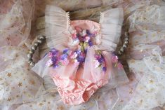 This is a listing for a romper/dress decorated with tulle ruffles, flowers and butterflies.  Sizes: 12 m             Ready to ship! All used materials are new. All items are made with care in a smoke/pet free environment. I would like to invite you to Your Dream Pix LLC VIP customers group!  Please, join us for all news and updates from my shop, new products, SALES and discounts.  https://www.facebook.com/groups/550907811777869/ Thank you! Cute Fairy Dress For Summer Garden Party, Fitted Princess Fairy Dress For Summer, Princess Style Fitted Fairy Dress For Summer, Fitted Princess Style Fairy Dress For Summer, Summer Cute Fitted Fairy Dress, Pink Whimsical Fairy Dress For Spring, Whimsical Pink Fairy Dress For Spring, Summer Princess Fairy Dress For Garden Party, Cute Summer Fairy Dress For Party