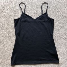 Express Womens Basic Black Tank Top Camisole Cami V Neck Spaghetti Strap Size Small New Without Tags Black Tank Top With Wide Adjustable Straps, Black V-neck Tank Top With Adjustable Straps, Black Seamless Spaghetti Strap Tops, Black Camisole With Adjustable Tank Straps, Black Camisole With Tank Straps, Black Seamless Spaghetti Strap Tank Top, Black Tank Top With Built-in Bra And Spaghetti Straps, Black Tank Top With Built-in Bra, Black Seamless Camisole With Tank Straps