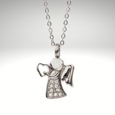 Ships to the USA Beautiful Angel Cremation Pendant, elegant and fine. Pendant comes with charm and  20'' link chain. Made from stainless steel, it is strong, durable, hypoallergenic and guaranteed not to tarnish!  Zen,Healing,Cremate,Crystal, Pet Instructions: Simply open carefully and add a couple specs of your loved ones cremains (you can use a toothpick to help  push the cremains in the chamber) then simply screw close. Warning: DO NOT OVER FILL AND DO NOT OVER TIGHTEN All orders are processe White Gold Crystal Pendant Necklace For Gift, White Gold Pendant Crystal Necklace For Gift, White Gold Crystal Necklace Gift, Personalized Silver Crystal Pendant Necklaces, Sterling Silver Necklace With Lobster Clasp For Keepsake, Personalized Silver Pendant Crystal Necklace, Silver Crystal Pendant Necklace With Charms, Personalized Sterling Silver Crystal Necklace, Personalized Spiritual Silver Crystal Necklaces