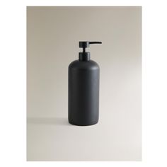 a black soap dispenser on a white background