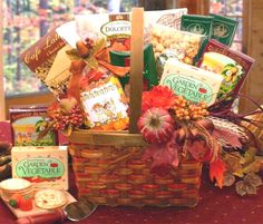 a basket filled with food sitting on top of a table next to other foods and snacks