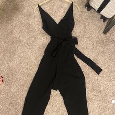 Long Black Romper With Tie - Super Flattering On! Black High Waist Jumpsuits And Rompers For Spring, Elegant Black Jumpsuits And Rompers For Day Out, Chic Black Jumpsuits And Rompers For Work, Chic Black Jumpsuits For Work, Black High-waist Jumpsuits And Rompers For Going Out, Chic Black Jumpsuits And Rompers For Night Out, Black Jumpsuits And Rompers For Spring Night Out, Black Romper, Long Black