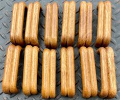 six wooden pieces of wood sitting on top of a metal surface